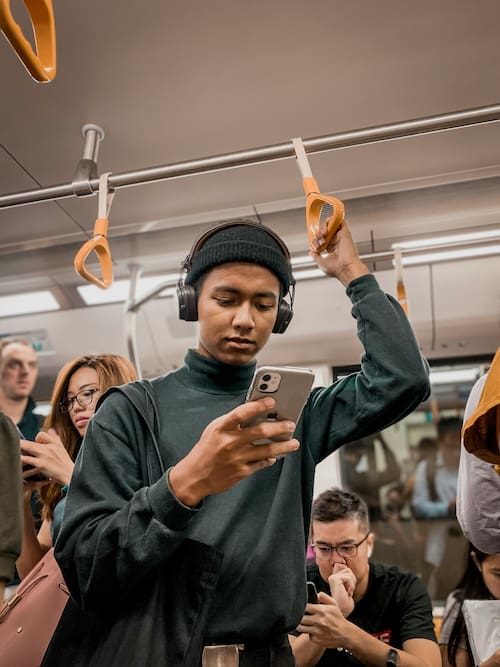 man on his phone in the subway